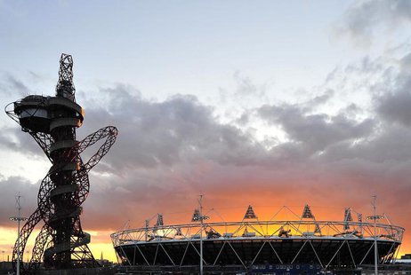 The sun sets behind the Olympic Stadium and Orbit tower at the Olympic Park in Stratford in east London March 7, 2012. REUTERS/Toby Melville The sun sets behind the Olympic Stadium and Orbit tower at the Olympic Park in Stratford in east London March 7, 2012. REUTERS/Toby Melville