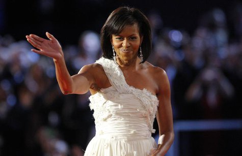 U.S. first lady Michelle Obama, dressed in Jason Wu, waves to the crowd after dancing her first dance of inauguration night with President B U.S. first lady Michelle Obama, dressed in Jason Wu, waves to the crowd after dancing her first dance of inauguration night with President B