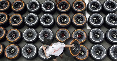 McLaren Formula One mechanic arranges Pirellis tyres in the paddock ahead of the Spanish Grand Prix at the Circuit de Catalunya in Montmelo, McLaren Formula One mechanic arranges Pirellis tyres in the paddock ahead of the Spanish Grand Prix at the Circuit de Catalunya in Montmelo,