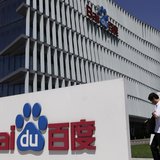An employee walks past the Baidu company signage outside its headquarters in Beijing, July 26, 2011. REUTERS/Soo Hoo Zheyang An employee walks past the Baidu company signage outside its headquarters in Beijing, July 26, 2011. REUTERS/Soo Hoo Zheyang