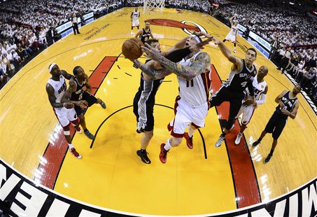 Miami Heat's Chris Andersen (11) goes to the basket against San Antonio Spurs' Tiago Splitter during Game 2 of their NBA Finals basketball p Miami Heat's Chris Andersen (11) goes to the basket against San Antonio Spurs' Tiago Splitter during Game 2 of their NBA Finals basketball p