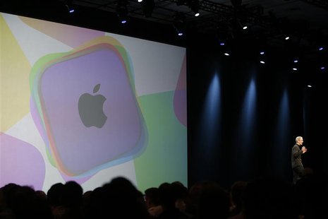 Apple Chief Executive Tim Cook takes the stage during the Apple Worldwide Developers Conference (WWDC) 2013 in San Francisco, California Jun Apple Chief Executive Tim Cook takes the stage during the Apple Worldwide Developers Conference (WWDC) 2013 in San Francisco, California Jun