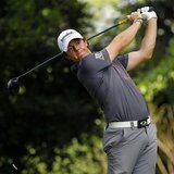 Rory McIllroy of Northern Ireland hits his tee shot on the second hole during a practice round for the 2012 Masters Golf Tournament at the A