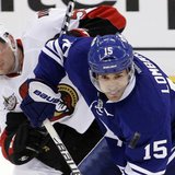 Toronto Maple Leafs' Matthew Lombardi (R) keeps the puck from Ottawa Senators' Sergei Gonchar during the third period of their NHL hockey ga