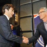 Dallas Eakins shakes hands with Edmonton Oilers' General Manager Craig MacTavish (R) during a news conference announcing Eakins' hiring as h