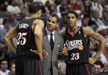 Former Philadelphia 76ers head coach Maurice Cheeks (C) talks with players Rodney Carney (L) and Louis Williams during the second half of Ga Former Philadelphia 76ers head coach Maurice Cheeks (C) talks with players Rodney Carney (L) and Louis Williams during the second half of Ga
