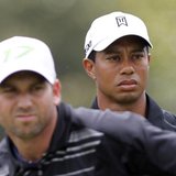 Tiger Woods watches Sergio Garcia tee off on the third hole during first round play in the WGC-Cadillac Championship golf tournament at the 
