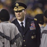 U.S. Army Chief of Staff General Ray Odierno (C) greets new Army recruits after leading them in their oath during an on-field induction cere