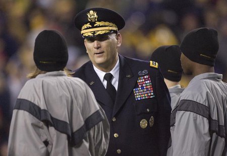 U.S. Army Chief of Staff General Ray Odierno (C) greets new Army recruits after leading them in their oath during an on-field induction cere U.S. Army Chief of Staff General Ray Odierno (C) greets new Army recruits after leading them in their oath during an on-field induction cere