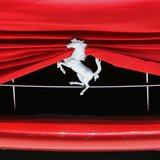 A cover is pictured on a Ferrari car at Ferrari booth during a preview day of the upcoming 80th Geneva Car Show at the Palexpo in Geneva Mar