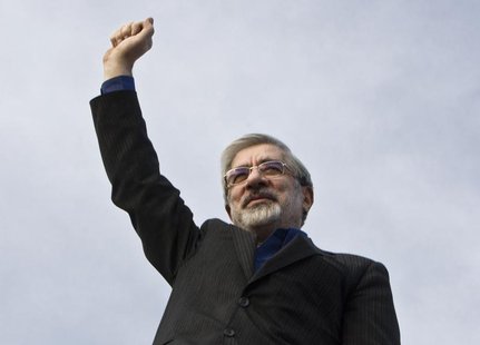 Iran's presidential election candidate Mirhossein Mousavi waves to supporters during an election campaign at a stadium in southern Tehran Ju Iran's presidential election candidate Mirhossein Mousavi waves to supporters during an election campaign at a stadium in southern Tehran Ju