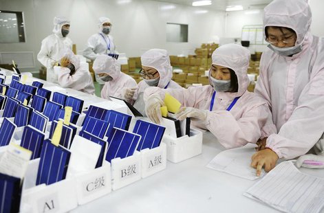 Employees inspect and sort solar panels into different quality categories at an LDK Solar company workshop in Hefei, Anhui province in this Employees inspect and sort solar panels into different quality categories at an LDK Solar company workshop in Hefei, Anhui province in this