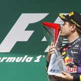Red Bull Formula One driver Sebastian Vettel of Germany kisses his trophy on the podium after winning the Canadian F1 Grand Prix at the Circ Red Bull Formula One driver Sebastian Vettel of Germany kisses his trophy on the podium after winning the Canadian F1 Grand Prix at the Circ