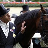 Trainer Henry Cecil poses for a photograph with the winning horse Frankel after the Queen Anne Stakes during the first day of racing at Roya