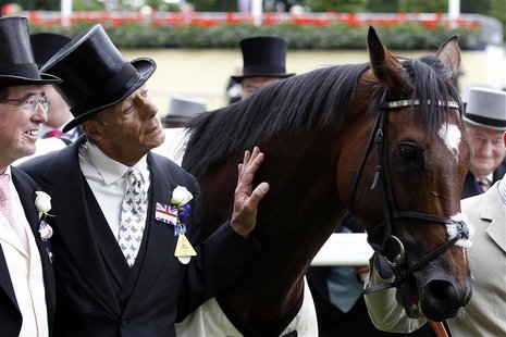 Trainer Henry Cecil poses for a photograph with the winning horse Frankel after the Queen Anne Stakes during the first day of racing at Roya Trainer Henry Cecil poses for a photograph with the winning horse Frankel after the Queen Anne Stakes during the first day of racing at Roya