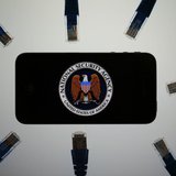 An illustration picture shows the logo of the U.S. National Security Agency on the display of an iPhone in Berlin, June 7, 2013. REUTERS/Paw