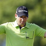 Spain's Sergio Garcia gestures as he walks down the 14th fairway during a practice round for the 2013 U.S. Open golf championship at the Mer
