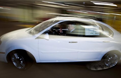 Daniel Weiss drives away in his all-electric CODA EV during an event at the Westfield Century City Mall in Los Angeles, California March 16, Daniel Weiss drives away in his all-electric CODA EV during an event at the Westfield Century City Mall in Los Angeles, California March 16,