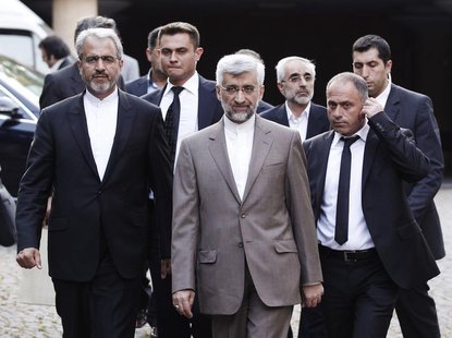 Iran's chief nuclear negotiator Saeed Jalili (C) arrives at the Iranian Consulate before his meeting with European Union foreign policy chie Iran's chief nuclear negotiator Saeed Jalili (C) arrives at the Iranian Consulate before his meeting with European Union foreign policy chie