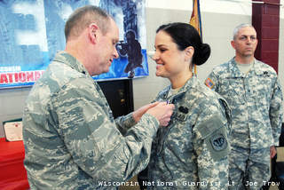 Maj. Gen. Donald Dunbar, the adjutant general of Wisconsin, awards the Purple Heart to Spc. Lindsay Peterson, of Green Bay, Wis. (courtesy of WI National Guard). Maj. Gen. Donald Dunbar, the adjutant general of Wisconsin, awards the Purple Heart to Spc. Lindsay Peterson, of Green Bay, Wis. (courtesy of WI National Guard).