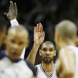 San Antonio Spurs' Tim Duncan celebrates with teammates near the end of the first half against the Miami Heat during Game 3 of their NBA Fin San Antonio Spurs' Tim Duncan celebrates with teammates near the end of the first half against the Miami Heat during Game 3 of their NBA Fin