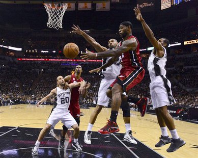 Miami Heat LeBron James (2nd R) has to pass off as San Antonio Spurs Tim Duncan (C) and Kawhi Leonard (R) defend during Game 3 of their NBA Miami Heat LeBron James (2nd R) has to pass off as San Antonio Spurs Tim Duncan (C) and Kawhi Leonard (R) defend during Game 3 of their NBA