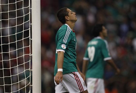 Javier Hernandez of Mexico reacts after missing a chance to score against Costa Rica during their 2014 World Cup qualifying soccer match at Javier Hernandez of Mexico reacts after missing a chance to score against Costa Rica during their 2014 World Cup qualifying soccer match at