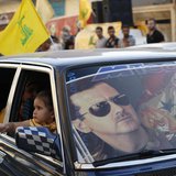 An image of Syria's President Bashar al-Assad is seen on a car's windscreen as Hezbollah supporters celebrate, after the Syrian army took co An image of Syria's President Bashar al-Assad is seen on a car's windscreen as Hezbollah supporters celebrate, after the Syrian army took co