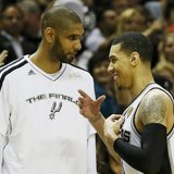 San Antonio Spurs' Danny Green (R) is congratulated by teammate Tim Duncan as he comes out of the game against the Miami Heat during the sec San Antonio Spurs' Danny Green (R) is congratulated by teammate Tim Duncan as he comes out of the game against the Miami Heat during the sec