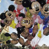 Balloons of Mickey Mouse are carried down main street at Disneyland in Anaheim, California, March 11, 2011. REUTERS/Mike Blake