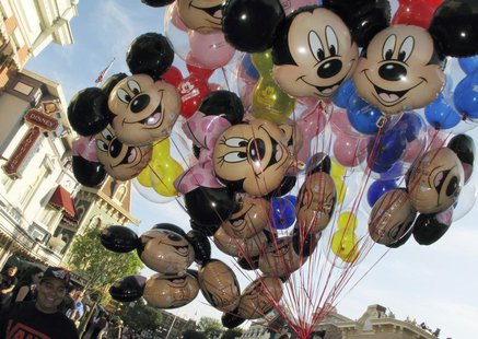 Balloons of Mickey Mouse are carried down main street at Disneyland in Anaheim, California, March 11, 2011. REUTERS/Mike Blake Balloons of Mickey Mouse are carried down main street at Disneyland in Anaheim, California, March 11, 2011. REUTERS/Mike Blake