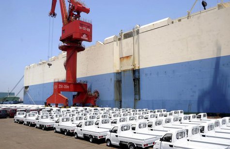 New trucks manufactured by Chinese automaker Chery are parked before being loading for export, next to a ship at a port in Lianyungang, Jian New trucks manufactured by Chinese automaker Chery are parked before being loading for export, next to a ship at a port in Lianyungang, Jian