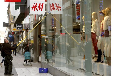 A worker cleans the windows of a branch store of H&M, Hennes & Mauritz, HMb.ST, the world's second-biggest fashion retailer in Sweden's capi A worker cleans the windows of a branch store of H&M, Hennes & Mauritz, HMb.ST, the world's second-biggest fashion retailer in Sweden's capi
