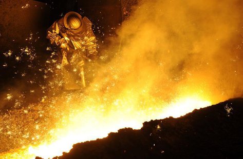 A steel-worker is pictured at a furnace at the plant of German steel company Salzgitter AG in Salzgitter, Lower Saxony late November 10, 201 A steel-worker is pictured at a furnace at the plant of German steel company Salzgitter AG in Salzgitter, Lower Saxony late November 10, 201