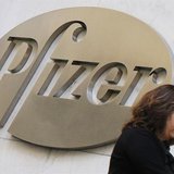 A woman walks past the Pfizer Inc. headquarters in New York, January 31, 2013. REUTERS/Brendan McDermid A woman walks past the Pfizer Inc. headquarters in New York, January 31, 2013. REUTERS/Brendan McDermid