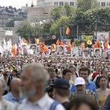 Participants hold portraits of detained activists and wave flags during an opposition protest march in Moscow, June 12, 2013. REUTERS/Sergei