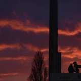 An ESPN cameraman is seen against an evening sky while filming Fulham and Manchester United warm up before their English Premier League socc An ESPN cameraman is seen against an evening sky while filming Fulham and Manchester United warm up before their English Premier League socc