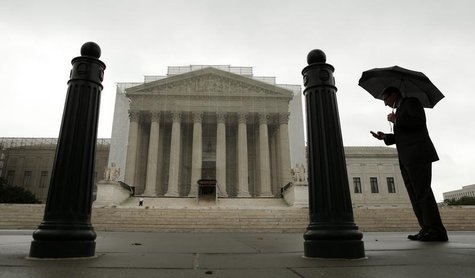 A man holds an umbrella outside the U..S. Supreme Court in Washington June 10, 2013. REUTERS/Kevin Lamarque A man holds an umbrella outside the U..S. Supreme Court in Washington June 10, 2013. REUTERS/Kevin Lamarque