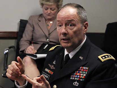 An aide (L) takes notes as U.S. General Keith Alexander, director of the National Security Agency (NSA) and U.S. Cyber Command, speaks to re An aide (L) takes notes as U.S. General Keith Alexander, director of the National Security Agency (NSA) and U.S. Cyber Command, speaks to re