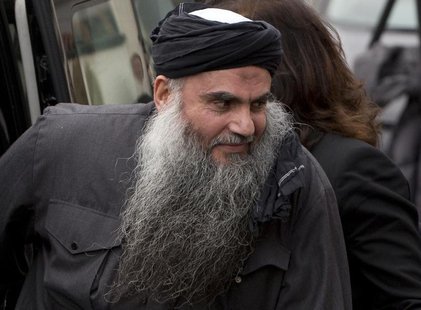 Radical Muslim cleric Abu Qatada is seen arriving back at his home after being released on bail, in London in this November 13, 2012 file ph Radical Muslim cleric Abu Qatada is seen arriving back at his home after being released on bail, in London in this November 13, 2012 file ph