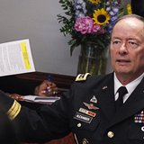 General Keith Alexander, director of the National Security Agency (NSA) and U.S. Cyber Command, gestures while speaking to reporters during General Keith Alexander, director of the National Security Agency (NSA) and U.S. Cyber Command, gestures while speaking to reporters during