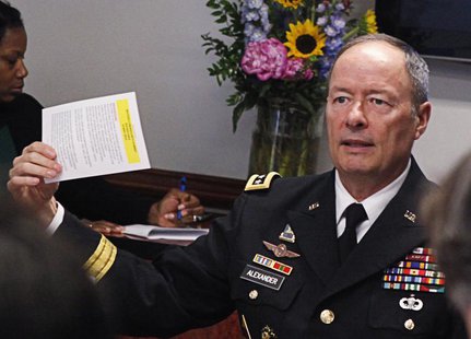 General Keith Alexander, director of the National Security Agency (NSA) and U.S. Cyber Command, gestures while speaking to reporters during General Keith Alexander, director of the National Security Agency (NSA) and U.S. Cyber Command, gestures while speaking to reporters during