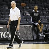 San Antonio Spurs Tony Parker (R) watches other players during practice for their NBA Finals basketball playoff series against the Miami Hea San Antonio Spurs Tony Parker (R) watches other players during practice for their NBA Finals basketball playoff series against the Miami Hea