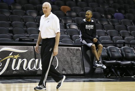 San Antonio Spurs Tony Parker (R) watches other players during practice for their NBA Finals basketball playoff series against the Miami Hea San Antonio Spurs Tony Parker (R) watches other players during practice for their NBA Finals basketball playoff series against the Miami Hea