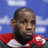 Miami Heat's LeBron James listens to a reporter's question before practice for their NBA Finals basketball playoff series against the San An Miami Heat's LeBron James listens to a reporter's question before practice for their NBA Finals basketball playoff series against the San An