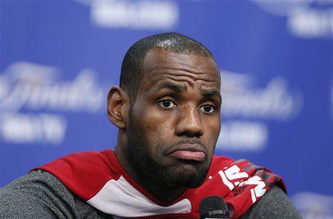 Miami Heat's LeBron James listens to a reporter's question before practice for their NBA Finals basketball playoff series against the San An Miami Heat's LeBron James listens to a reporter's question before practice for their NBA Finals basketball playoff series against the San An