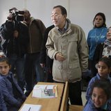 United Nations (U.N.) Secretary-General Ban Ki-moon speaks with children during his visit to a U.N.-run school in Al Zaatri refugee camp, in