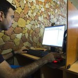 A customer uses a computer at an internet cafe in Tehran May 9, 2011.REUTERS/Raheb Homavandi