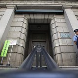 A security personnel stands guard at the Bank of Japan building in Tokyo, May 22, 2013. REUTERS/Yuya Shino