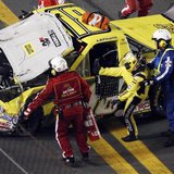 Jason Leffler is pulled from his number 18 Toyota after a crash in the NASCAR Camping World Series NextEra Energy Resources 250 truck race a